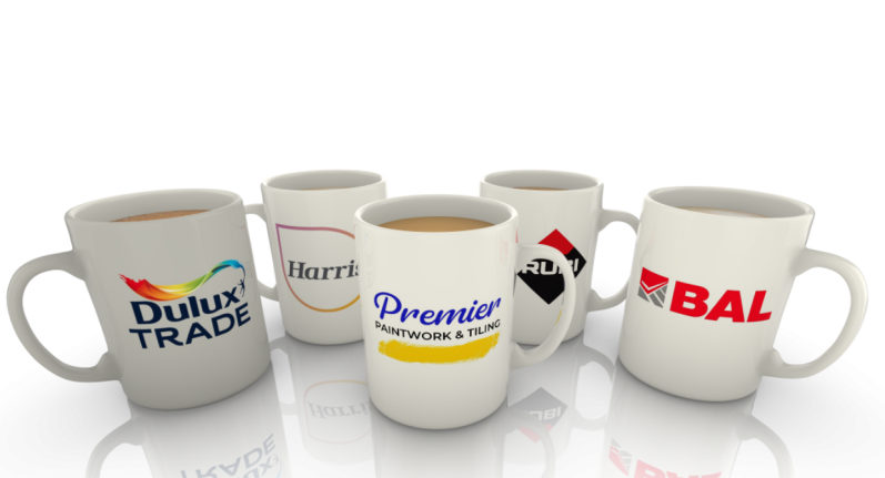 Five coffee mugs with various logos and designs, arranged in a group.